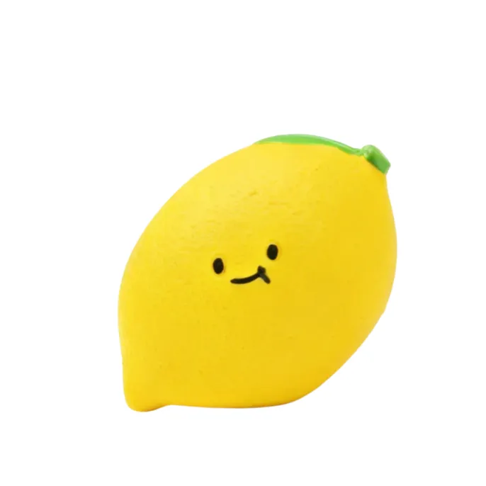 Yellow lemon-shaped latex squeaky dog toy with cute cartoon face