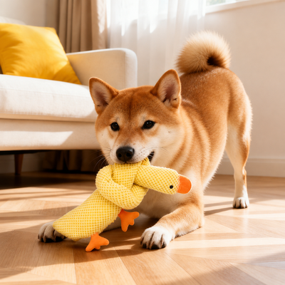 Long Neck Squeaky Dog Toy for Tug and Interactive Play Dog biting and playing with a knotted yellow long neck plush dog toy