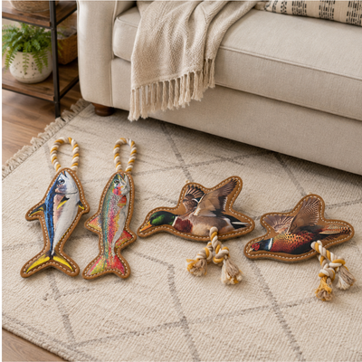 Suede Leather Fish and Bird Dog Toy Collection Assorted suede leather dog toys with fish duck and pheasant designs displayed in living room