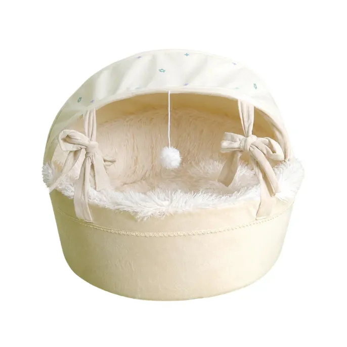 Soft Enclosed Cradle Cat Bed with Canopy Cream enclosed cradle cat bed with plush lining, canopy, bow ties and hanging pom-pom toy on white background