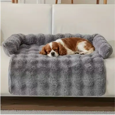 Cozy Plush Dog Bed for Sofa and Home Use Small dog sleeping comfortably on a soft grey plush dog bed with raised sides on a sofa