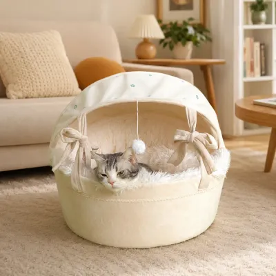 Cat relaxing inside a cozy covered cradle cat bed in a warm living room