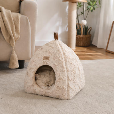 Cozy Plush Cat House for Indoor Cats Cat sleeping inside a cream plush enclosed cat house in a cozy living room
