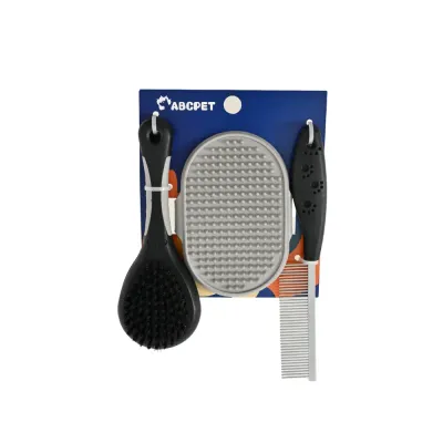 Retail-packaged dog and cat grooming kit with pin brush, silicone bathing glove and metal comb on a white background.