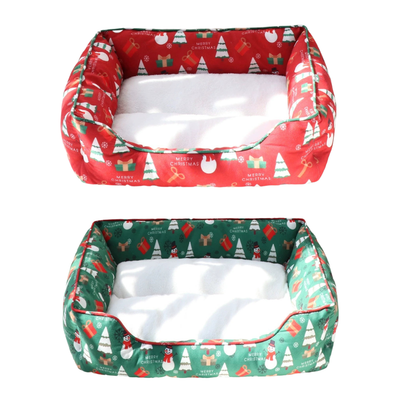 Red and green Christmas dog beds with festive holiday patterns and soft white cushions
