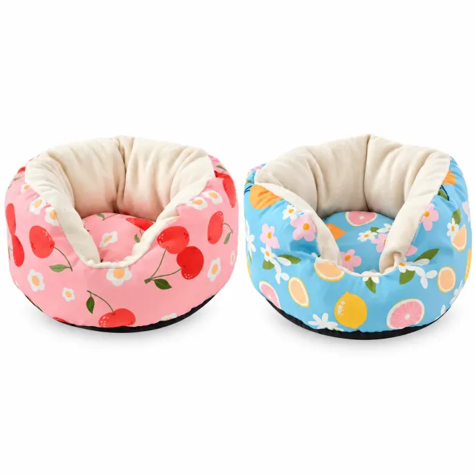 Pink Cherry and Blue Lemon Small Pet Sofa Beds with Plush Lining Two soft small pet sofa beds in pink cherry and blue lemon patterns with cream plush interiors, padded raised sides, and black bases.