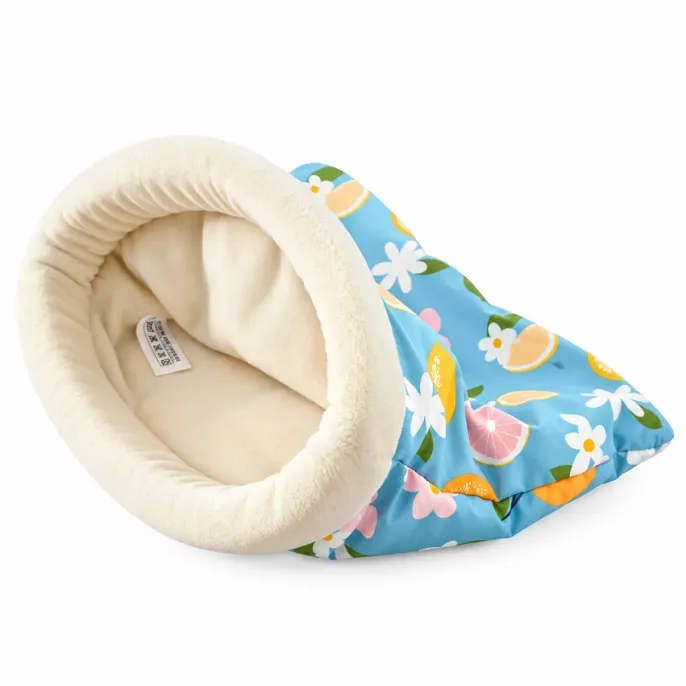 Blue Lemon Soft Small Animal Sleeping Bag Bed Blue lemon patterned small animal sleeping bag bed with a cream plush interior, padded round opening, and colorful citrus floral design.