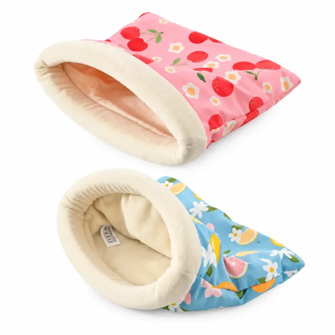 Pink Cherry and Blue Lemon Rabbit Sleeping Bag Beds Two small pet sleeping bag beds in pink cherry and blue lemon patterns with soft cream plush interiors and padded openings on a white background.