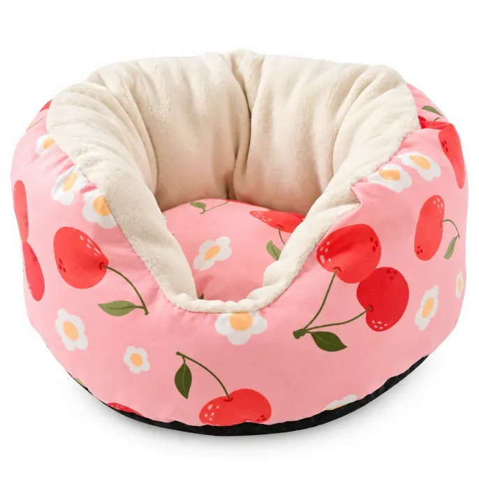 Pink Cherry Soft Plush Small Pet Sofa Bed for Rabbits Pink cherry patterned small pet sofa bed with cream plush interior, raised padded sides, cushioned sleeping area, and black base.