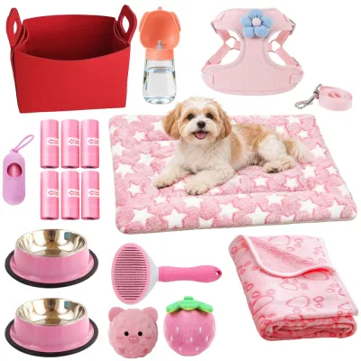 Pink Puppy Starter Kit with Dog Bed Mat Toys and Accessories Complete pink puppy starter kit featuring a pet mat with a small dog, two stainless steel bowls, harness, leash, plush toys, blanket and grooming supplies.