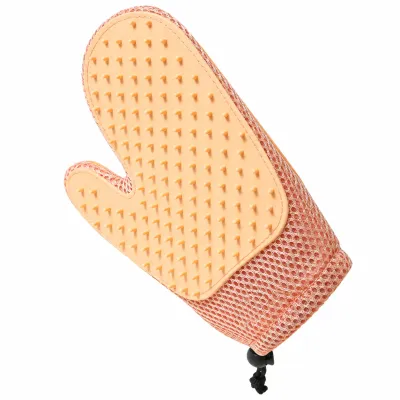 Peach Pink Silicone Pet Grooming Glove for Dogs and Cats Peach pink pet grooming glove with raised silicone grooming nubs on the palm, breathable mesh fabric on the back, and an adjustable wrist closure on a white background.